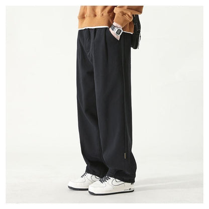 Wide leg relaxed pleated pants with stacked length for men | Corvane